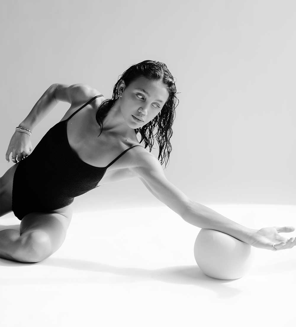 Coach doing an exercise with a ball